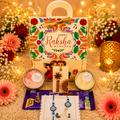 Thoughtfully Curated Rakhi Gift Hamper with Flower Candles, Scented Wax Sachet, Dairy Milk Chocolate & Premium Rakhi